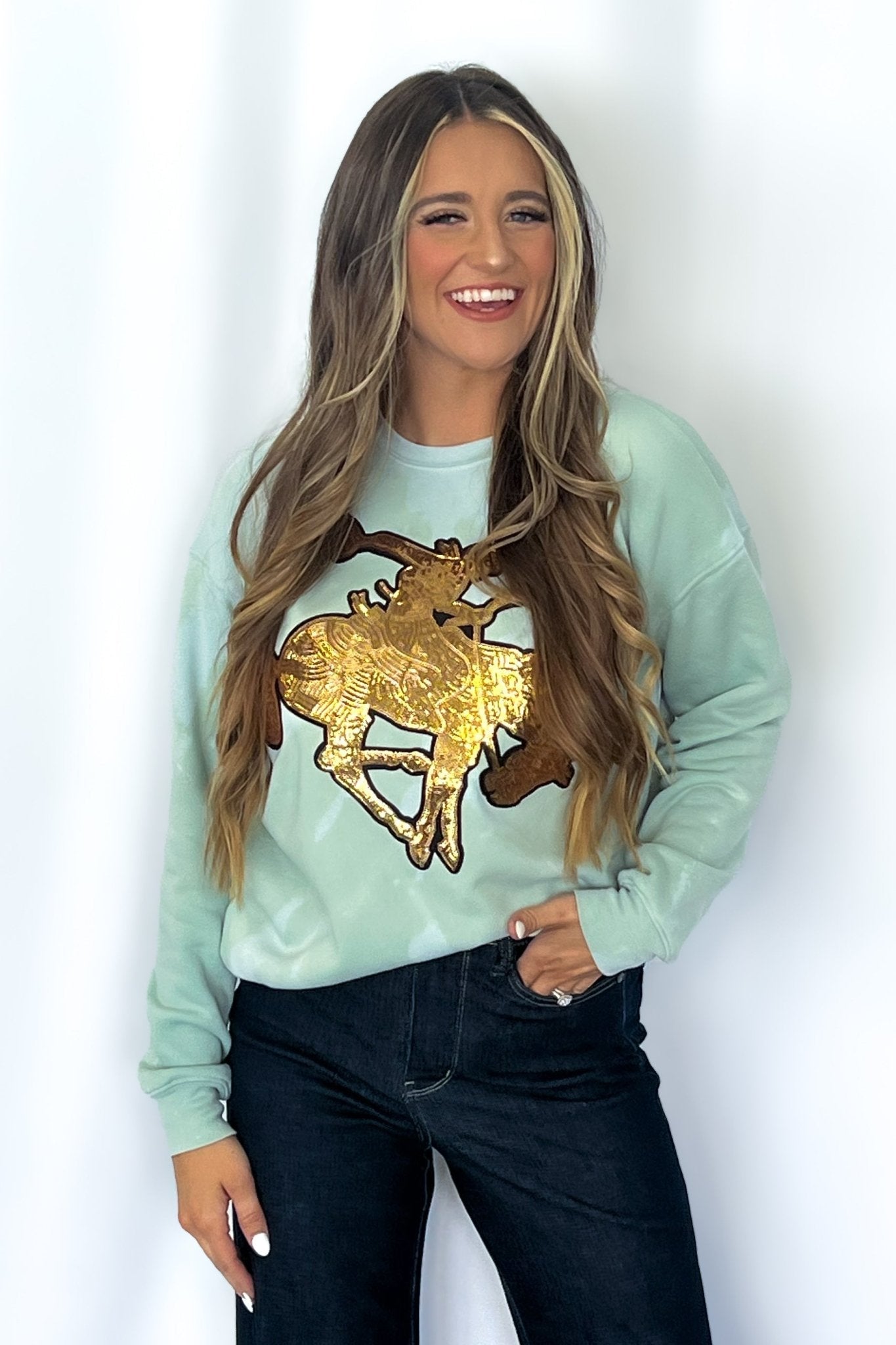 Crazy Consuela "Gold Sequin Horse" Bleached Western Sweatshirt — Bella + Canvas Aqua Sky Background with Cowboy Patch - Rooted & Reckless Co.