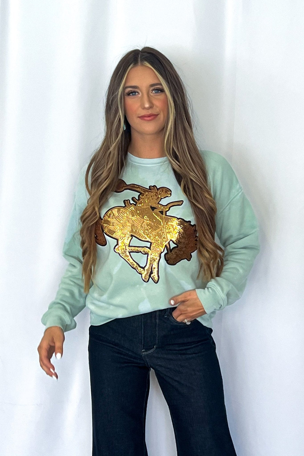Crazy Consuela "Gold Sequin Horse" Bleached Western Sweatshirt — Bella + Canvas Aqua Sky Background with Cowboy Patch - Rooted & Reckless Co.