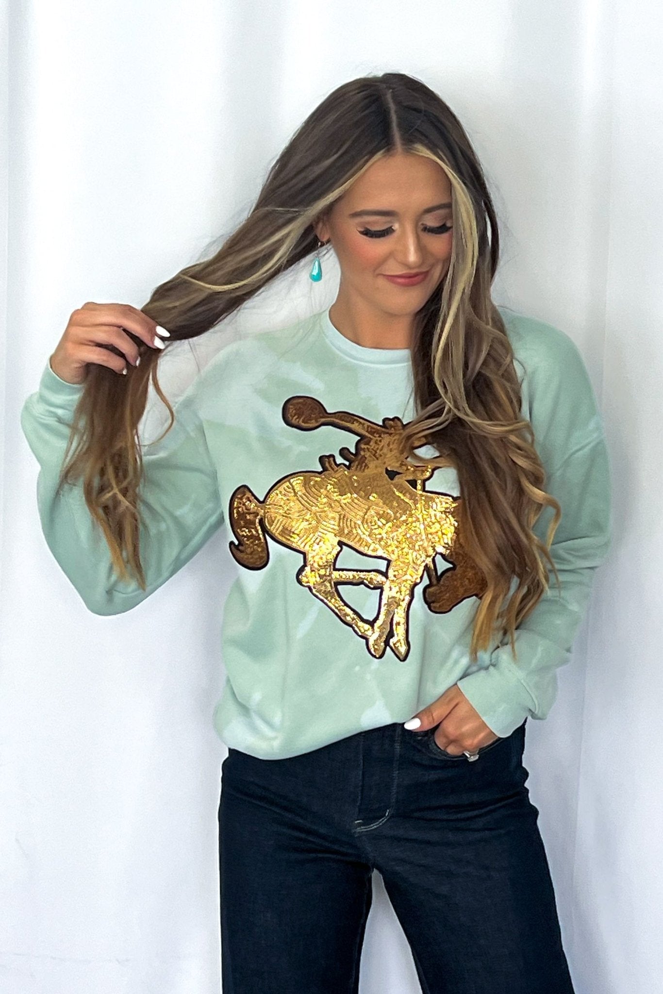 Crazy Consuela "Gold Sequin Horse" Bleached Western Sweatshirt — Bella + Canvas Aqua Sky Background with Cowboy Patch - Rooted & Reckless Co.