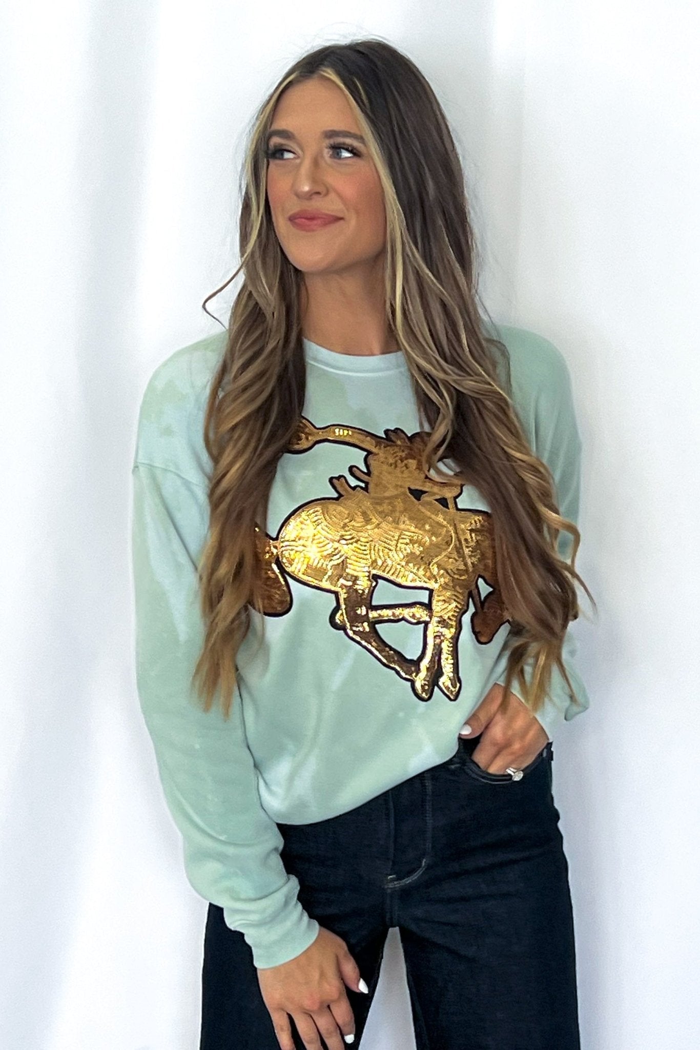 Crazy Consuela "Gold Sequin Horse" Bleached Western Sweatshirt — Bella + Canvas Aqua Sky Background with Cowboy Patch - Rooted & Reckless Co.
