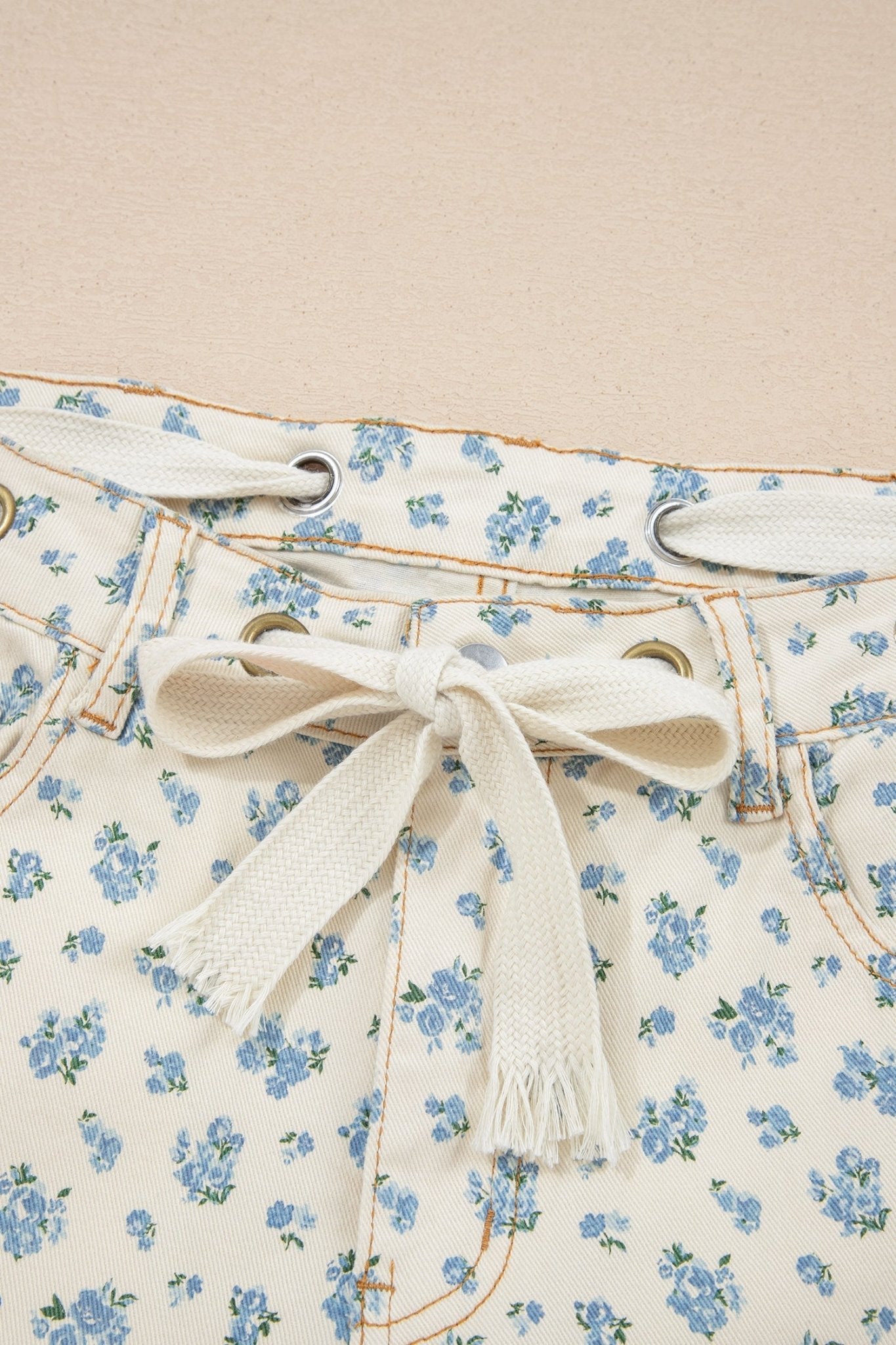 Floral Grommet Knot Waist Barrel Leg Jeans - Rooted & Reckless Co.