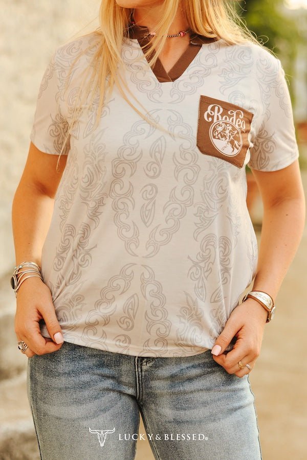 "Ivory Brown Boot Stitch Rodeo" Western Printed Stretch Top — Allover Boot Stitch with Contrast Pocket & V-Neck - Rooted & Reckless Co.