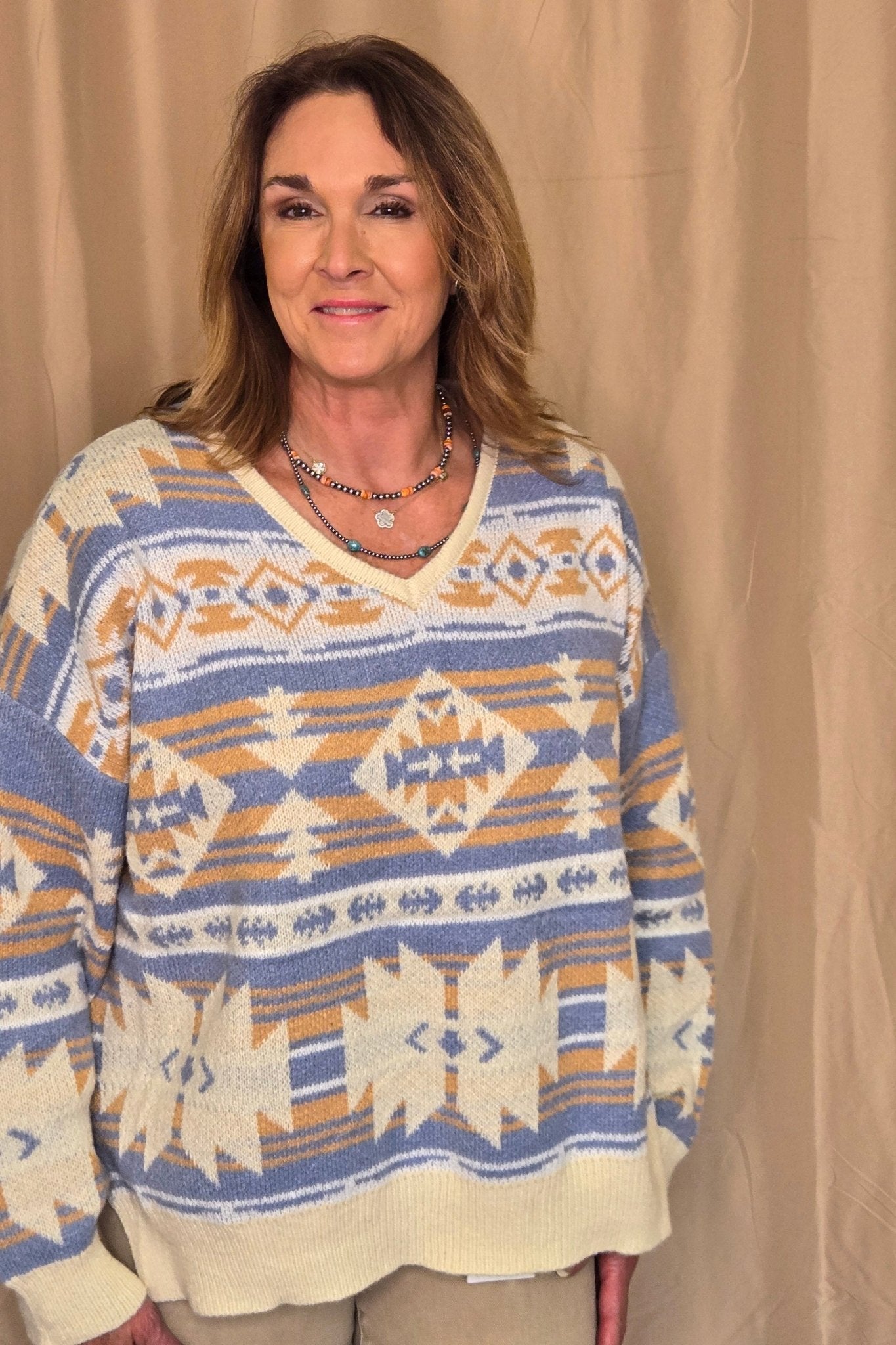 Main Strip Southwestern Knit Sweater — Oversized V-Neck with Bold Blue, Tan & Cream Print - Rooted & Reckless Co.