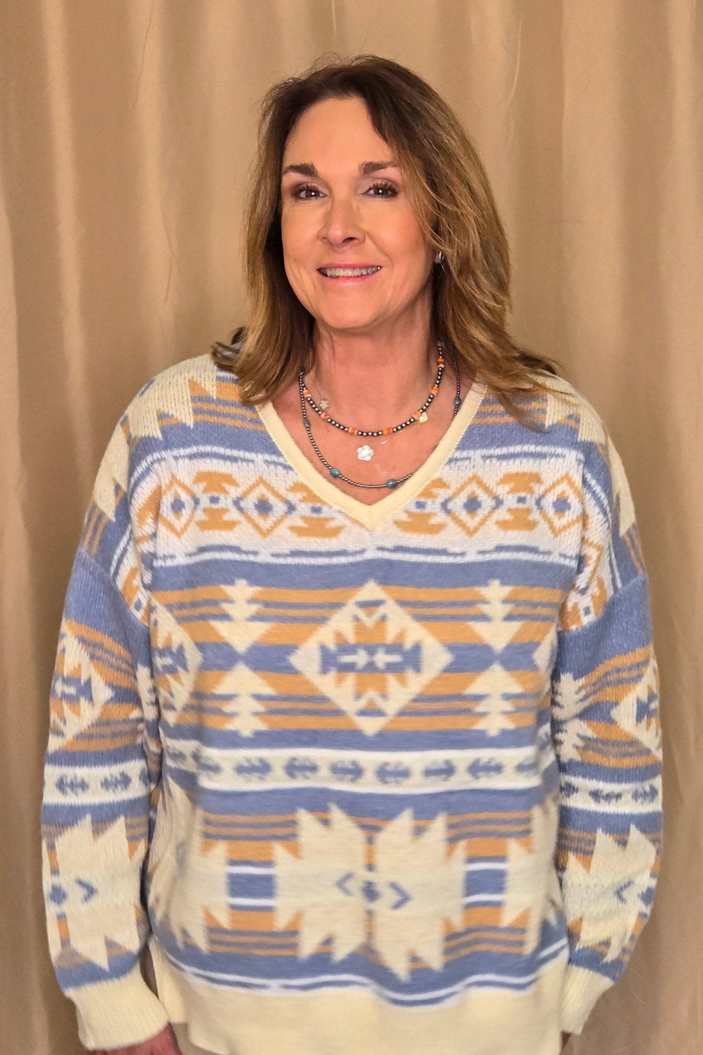 Main Strip Southwestern Knit Sweater — Oversized V-Neck with Bold Blue, Tan & Cream Print - Rooted & Reckless Co.