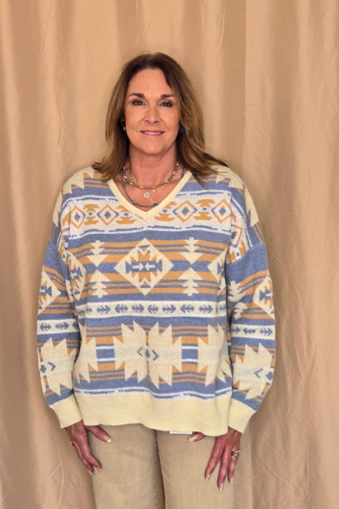 Main Strip Southwestern Knit Sweater — Oversized V-Neck with Bold Blue, Tan & Cream Print - Rooted & Reckless Co.