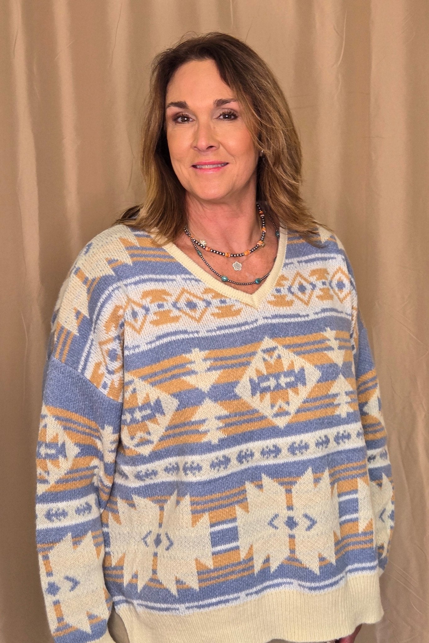 Main Strip Southwestern Knit Sweater — Oversized V-Neck with Bold Blue, Tan & Cream Print - Rooted & Reckless Co.