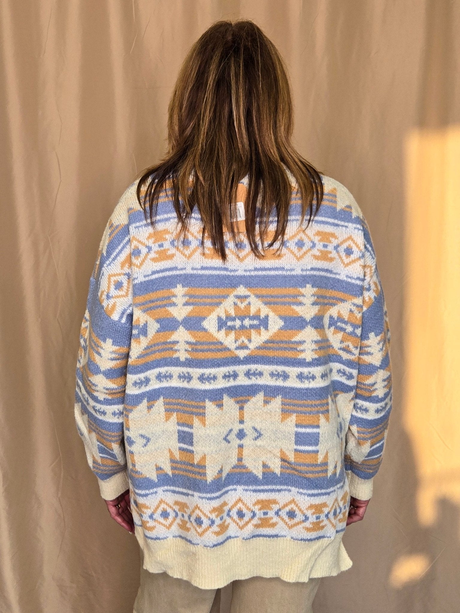Main Strip Southwestern Knit Sweater — Oversized V-Neck with Bold Blue, Tan & Cream Print - Rooted & Reckless Co.