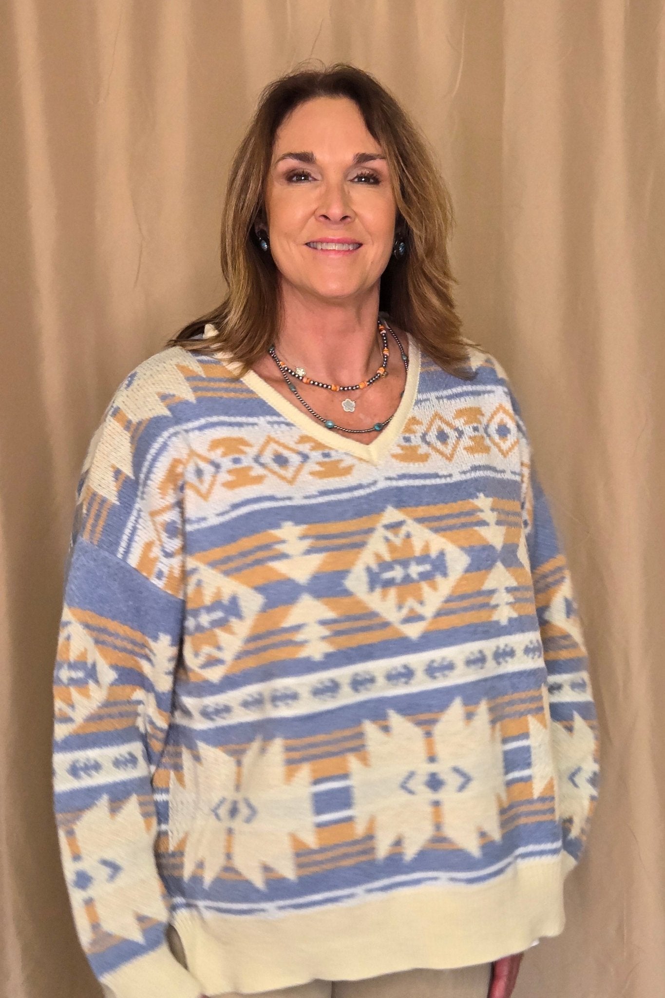 Main Strip Southwestern Knit Sweater — Oversized V-Neck with Bold Blue, Tan & Cream Print - Rooted & Reckless Co.