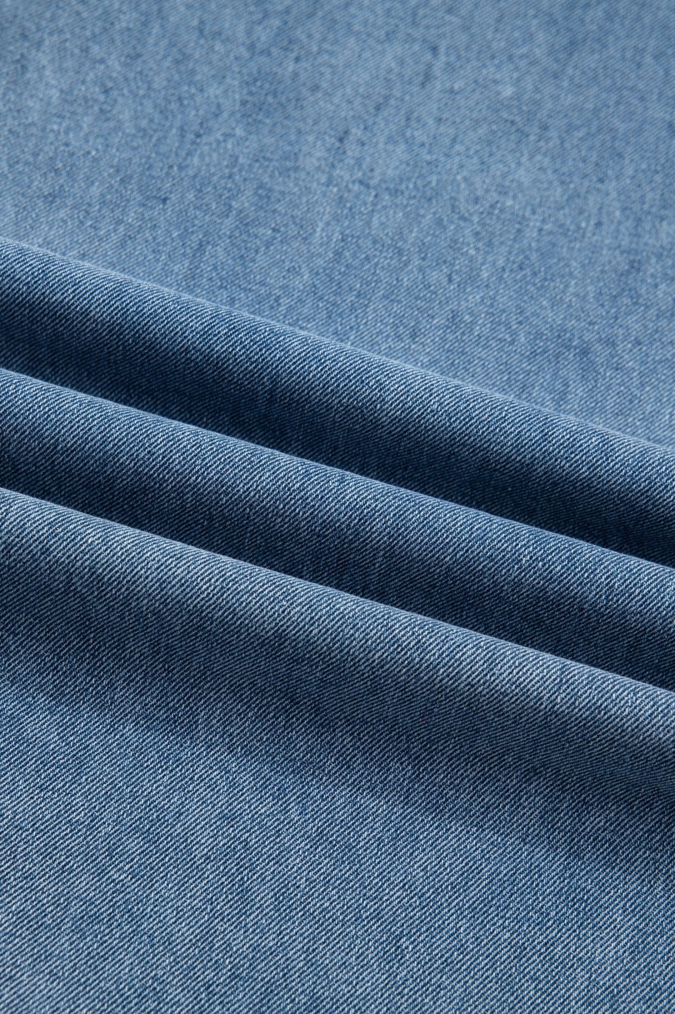 Pleated Wide Leg Pocketed Denim Jumpsuit - Rooted & Reckless Co.