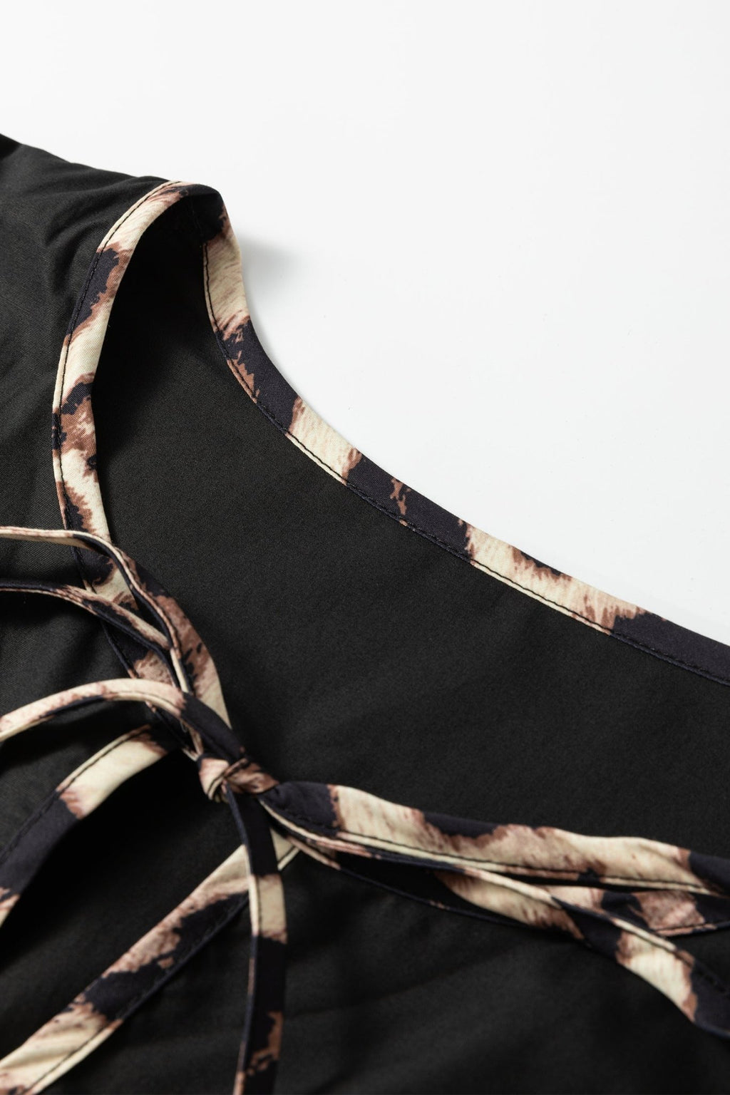 Plus Size Leopard Contrast Trim Tie-Neck Mini Dress - Rooted & Reckless Co.