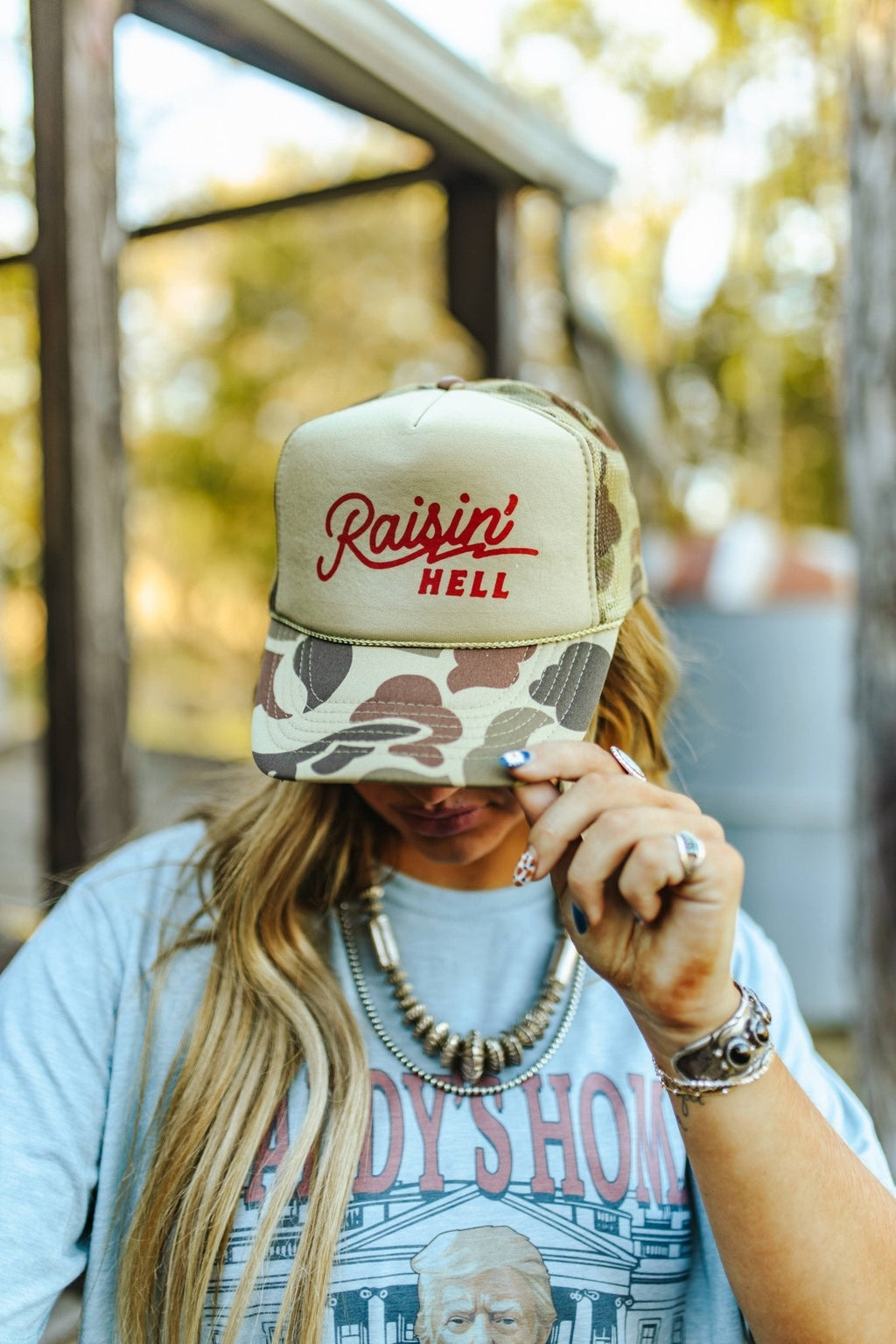 Raisin' Hell Green Camo Trucker Hat - Rooted & Reckless Co.