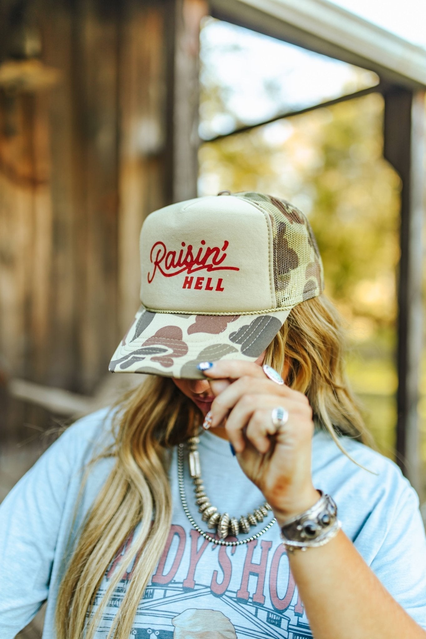 Raisin' Hell Green Camo Trucker Hat - Rooted & Reckless Co.