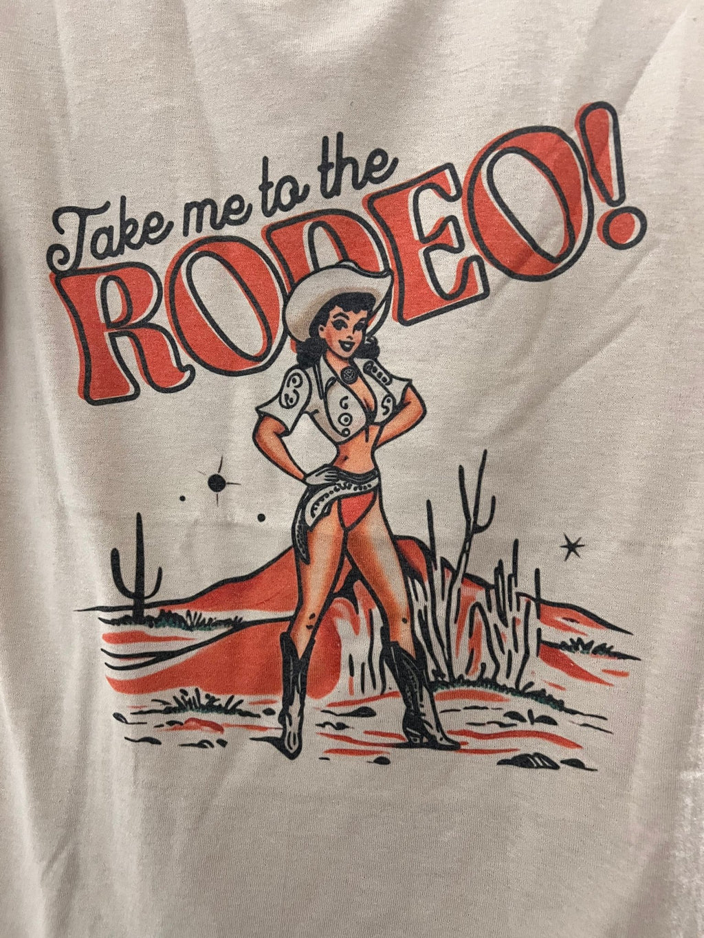 Retro "Take Me To The Rodeo" Pin-Up Cowgirl Western Graphic Tee — Tan Jerzees 50/50 Vintage Style - Rooted & Reckless Co.