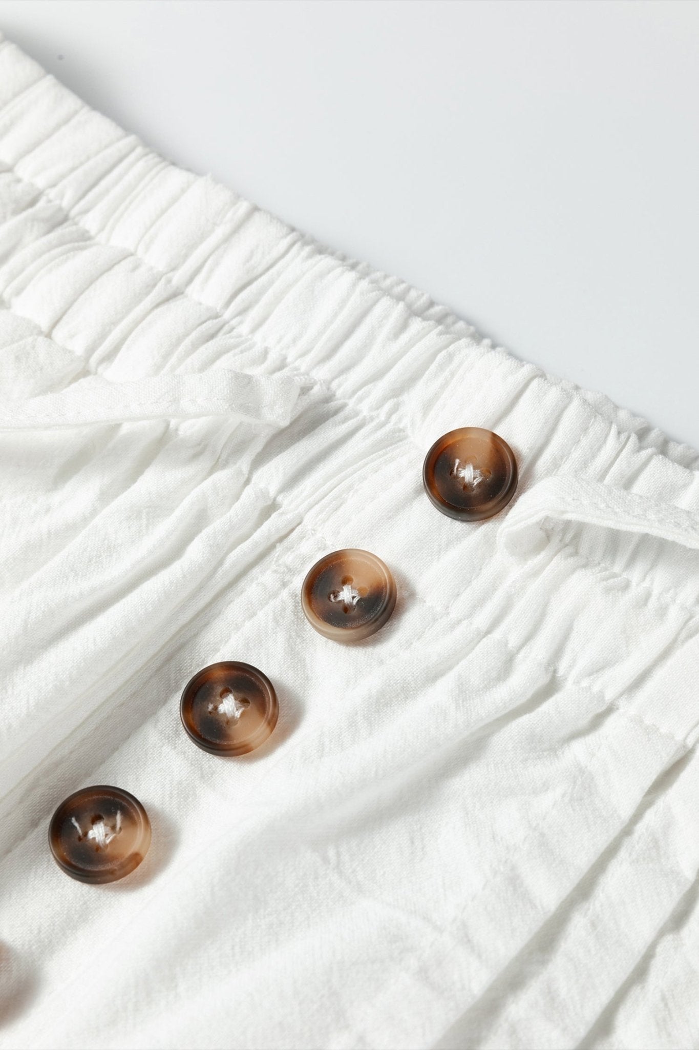 Solid Buttoned Drawstring Waist Pleated Wide Leg Pants - Rooted & Reckless Co.