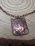 Western Rustic Brass Rodeo Pendant Necklace — 22 Inch Cowgirl Statement - Rooted & Reckless Co.